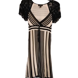 Bebe dress V cut Sz XS Black/white striped with stretchy floral pattern on arm